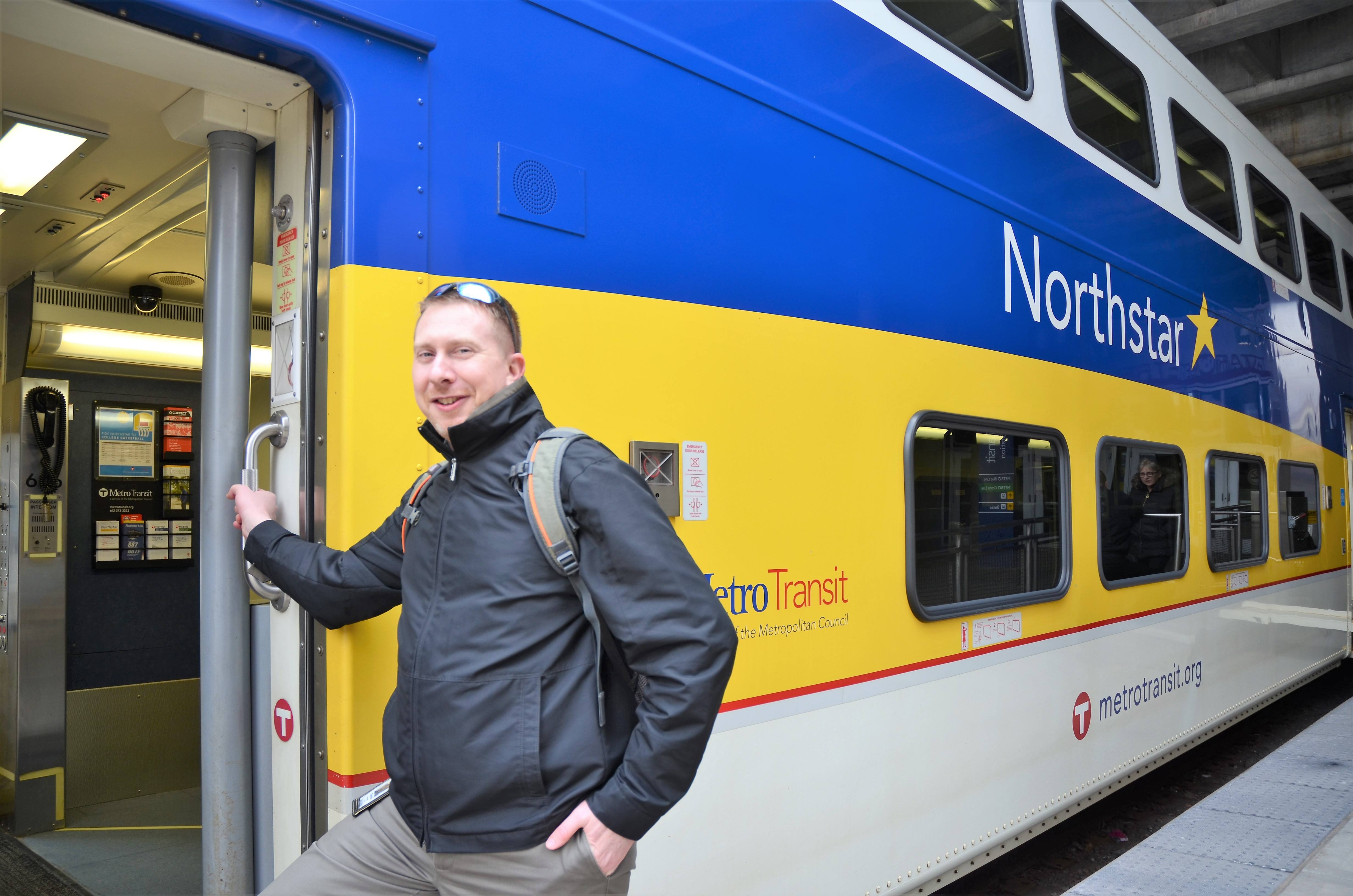 Associate Planner Clayton Watercott boards the Northstar Commuter Rail Line at Target Field Station in Minneapolis. Associate Planner Clayton Watercott boards the Northstar Commuter Rail Line at Target Field Station in Minneapolis.