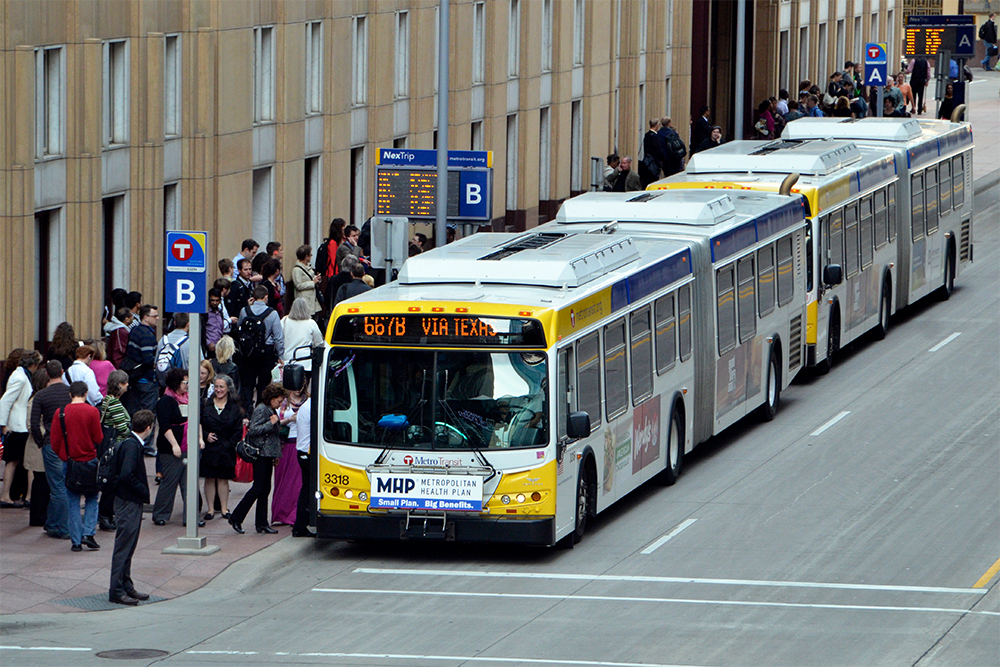 Commuters exit a Metro Transit bus in downtown Minneapolis. Commuters exit a Metro Transit bus in downtown Minneapolis.