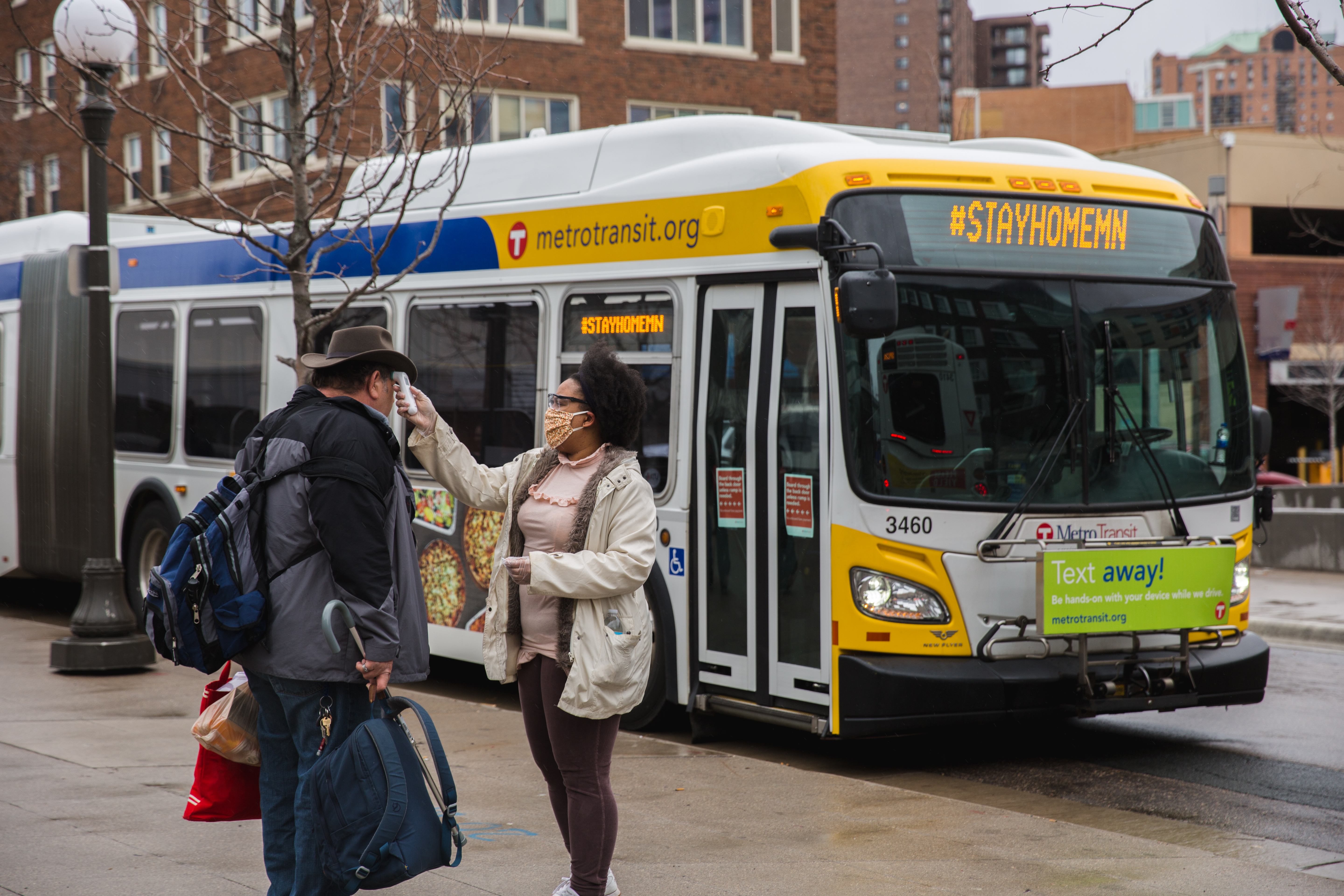 A person prepares to board a Metro Transit bus to be transported to a Saint Paul hotel. A person prepares to board a Metro Transit bus to be transported to a Saint Paul hotel.