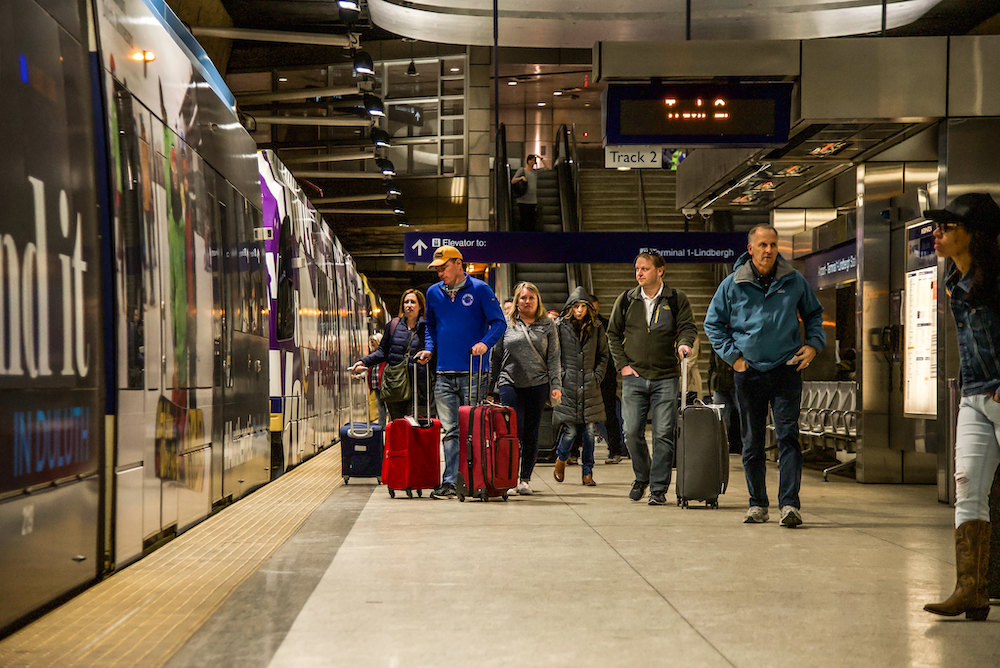 photo of customers with luggage at rail station