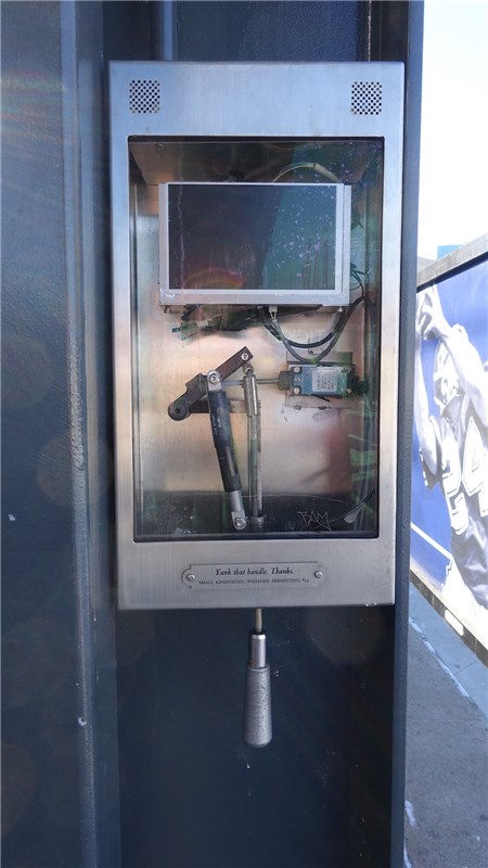 Title: Yank the handle Material: Stainless Steel box, glass, audio components, speaker, handle mechanism and title plate.